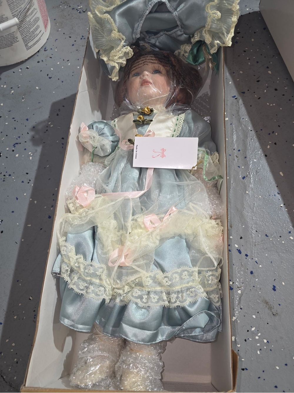 Impressions Light Blue Porcelain Doll in Frilly Dress